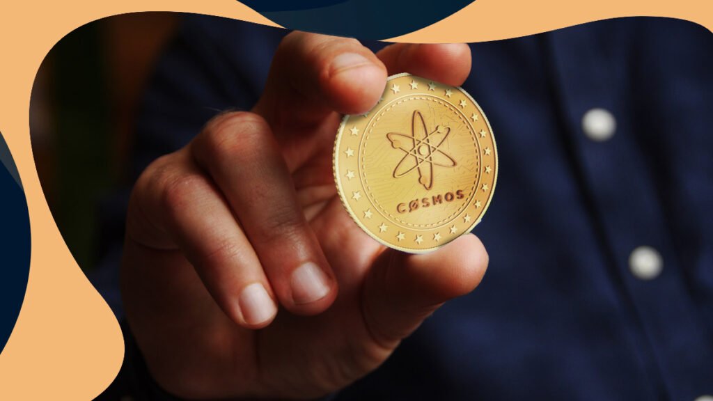 cosmos price prediction man holding cosmos coin